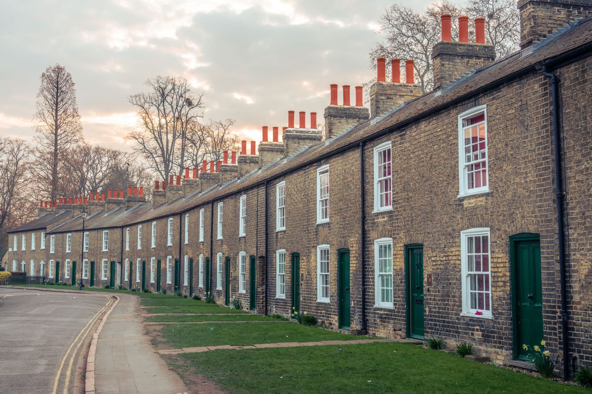 Row of well-maintained UK terraced houses with quality roofing